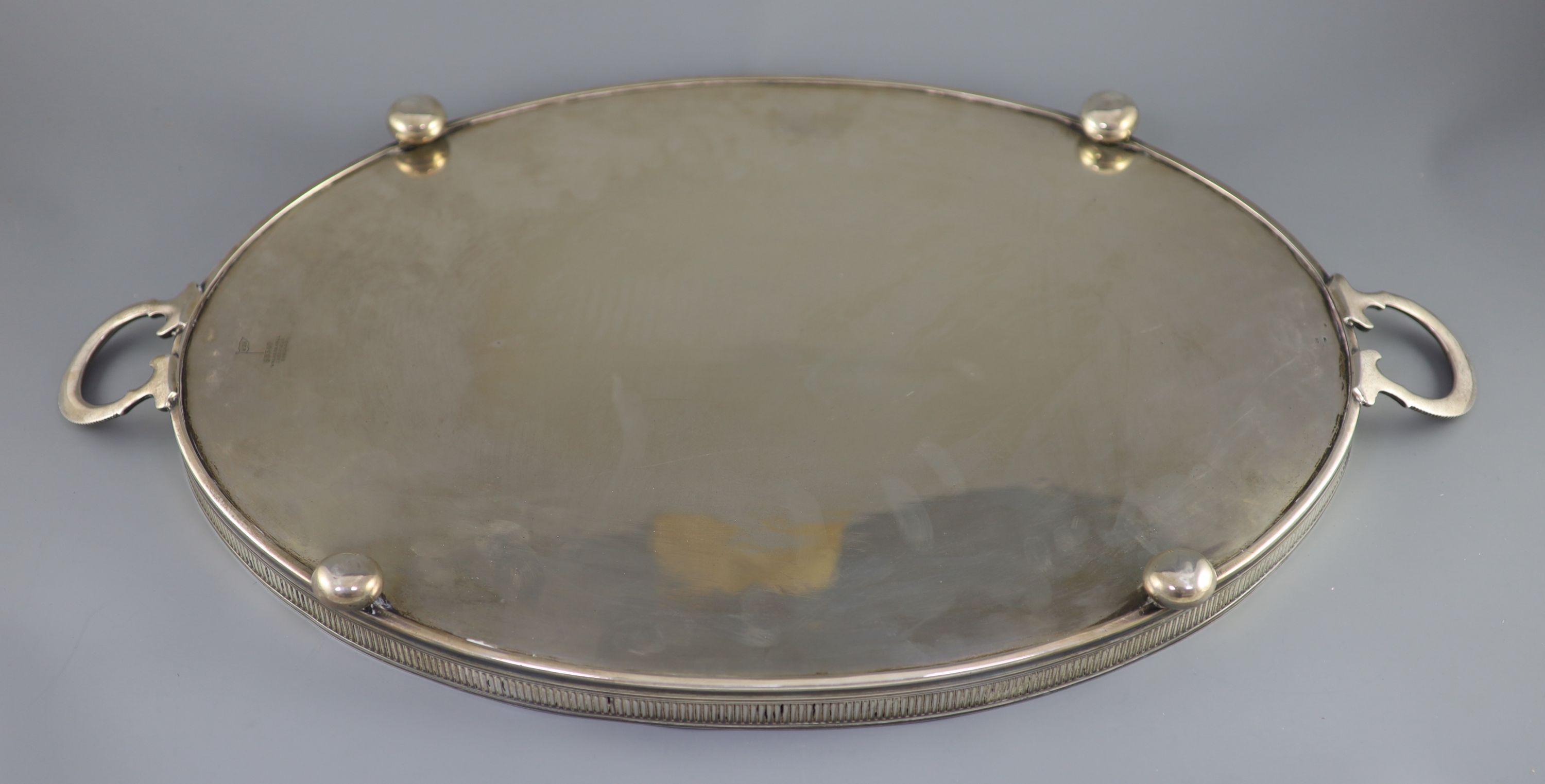 An Edwardian silver two handled oval tea tray, c.1901, by Walker & Hall